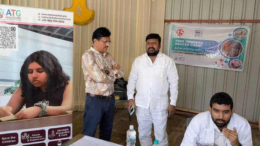 Community members and health workers taking part in free eye test.