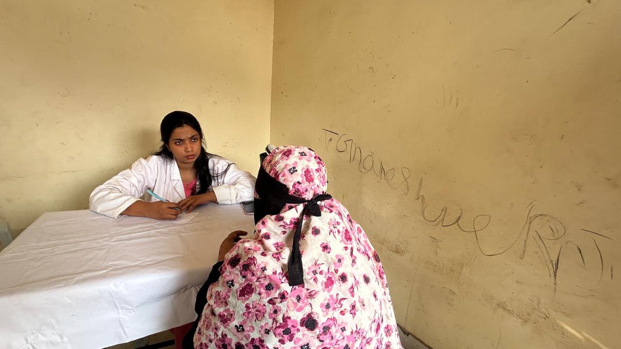 Doctor consulting a woman at an ATG Foundation free health camp